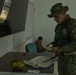 U.S. Marines with Littoral Craft Company Charlie, eat jackfruit with their Colombian Marine Corps Instructor