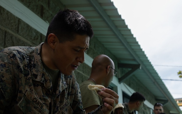 U.S. Marines with Littoral Craft Company Charlie, eat jackfruit with their Colombian Marine Corps Instructor
