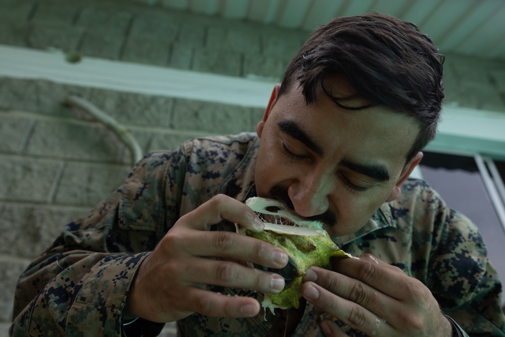 U.S. Marines with Littoral Craft Company Charlie, eat jackfruit with their Colombian Marine Corps Instructor