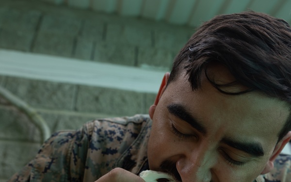U.S. Marines with Littoral Craft Company Charlie, eat jackfruit with their Colombian Marine Corps Instructor