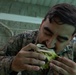 U.S. Marines with Littoral Craft Company Charlie, eat jackfruit with their Colombian Marine Corps Instructor