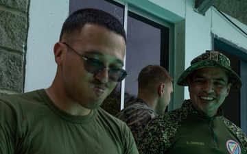 U.S. Marines with Littoral Craft Company Charlie, eat jackfruit with their Colombian Marine Corps Instructor