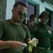 U.S. Marines with Littoral Craft Company Charlie, eat jackfruit with their Colombian Marine Corps Instructor