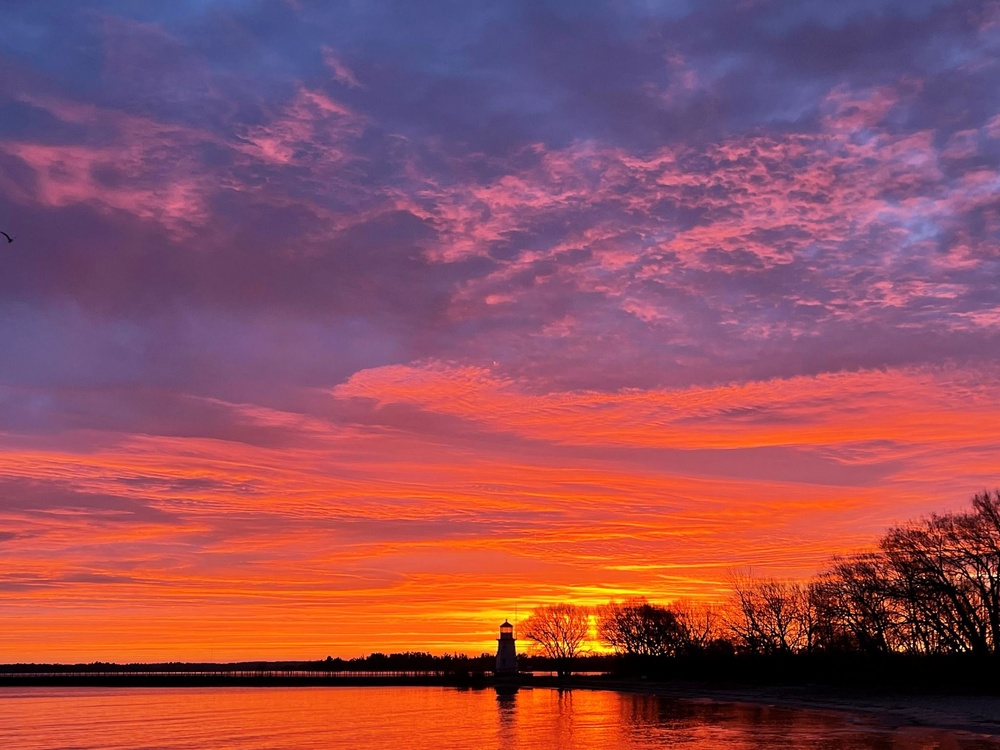 Purple and orange sunrise at Cheboygan River Crib Light