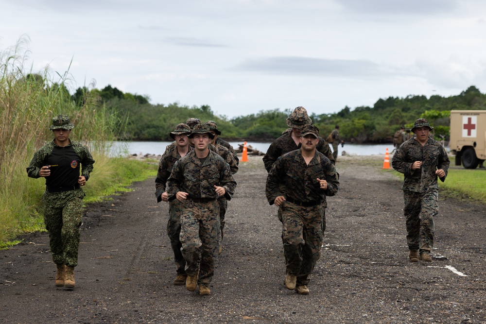 U.S. Marines with Littoral Craft Company Charlie participate in an exercise gauntlet during the Colombian Fluvial Operations Course