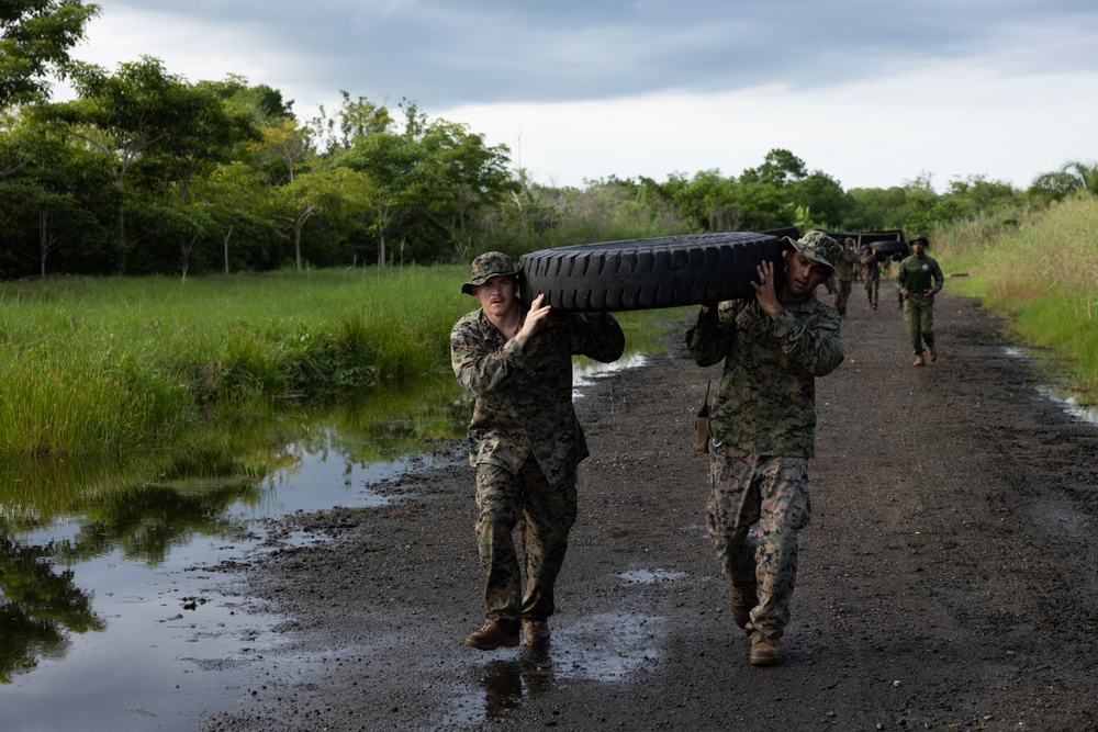 U.S. Marines with Littoral Craft Company Charlie participate in an exercise gauntlet during the Colombian Fluvial Operations Course