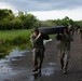 U.S. Marines with Littoral Craft Company Charlie participate in an exercise gauntlet during the Colombian Fluvial Operations Course