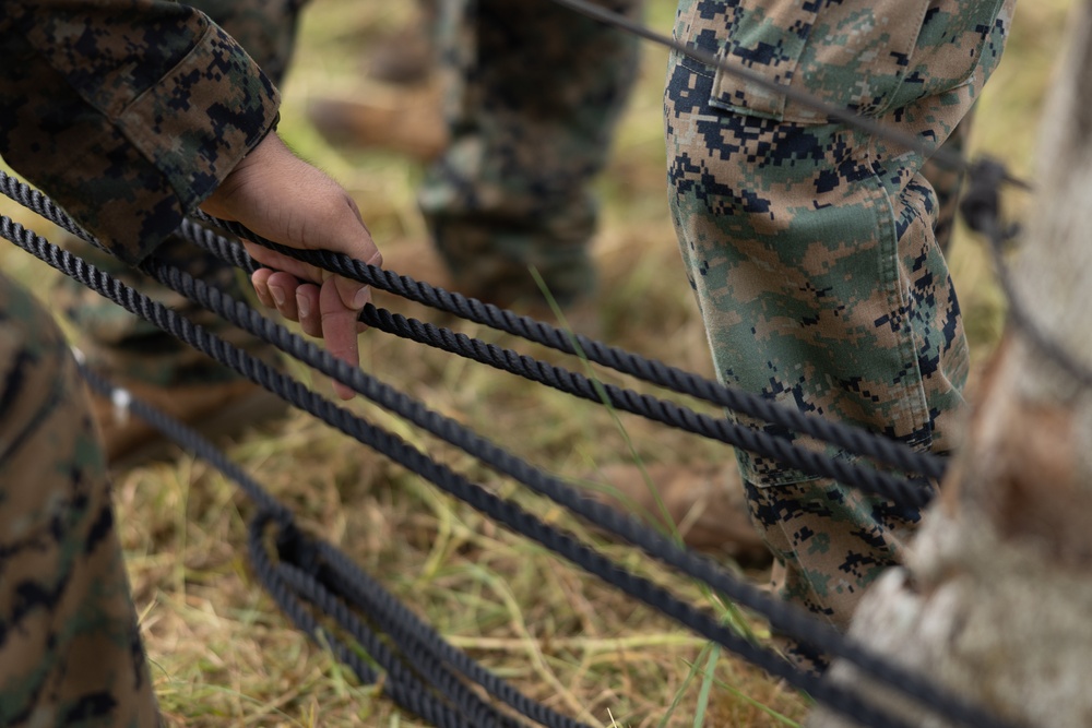 U.S. Marines with Littoral Craft Company Charlie participate in an exercise gauntlet during the Colombian Fluvial Operations Course