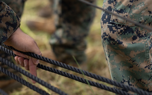 U.S. Marines with Littoral Craft Company Charlie participate in an exercise gauntlet during the Colombian Fluvial Operations Course