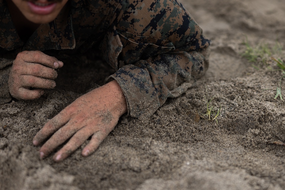 U.S. Marines with Littoral Craft Company Charlie participate in an exercise gauntlet during the Colombian Fluvial Operations Course