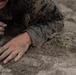 U.S. Marines with Littoral Craft Company Charlie participate in an exercise gauntlet during the Colombian Fluvial Operations Course