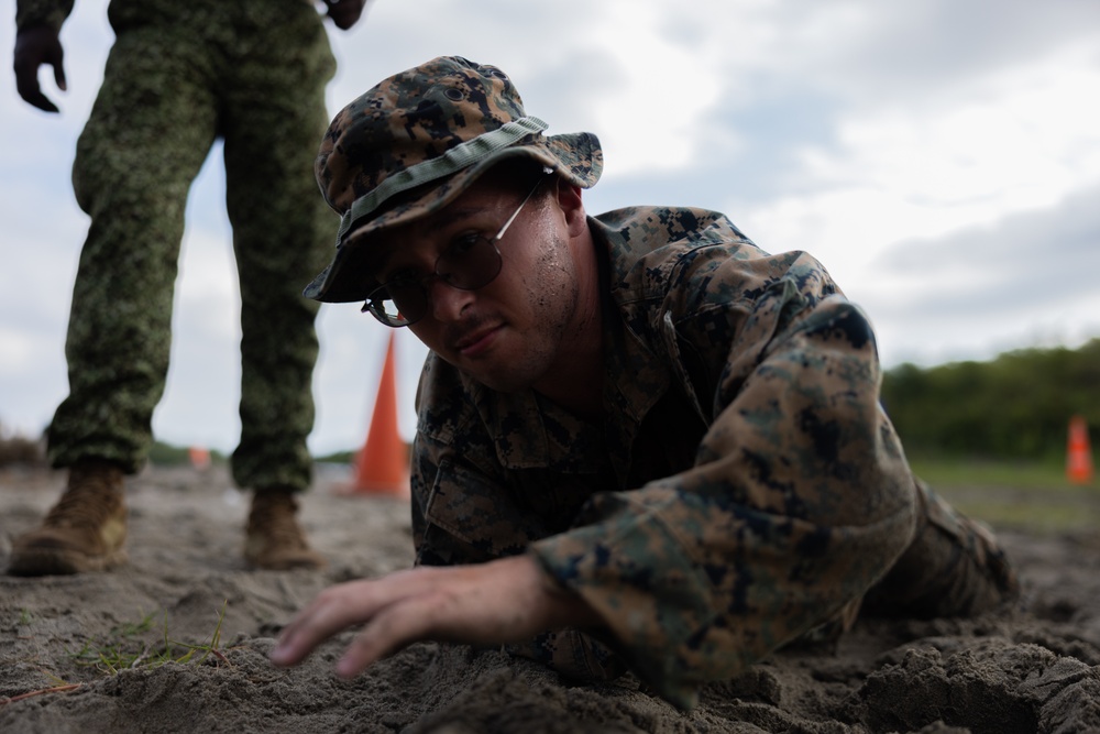 U.S. Marines with Littoral Craft Company Charlie participate in an exercise gauntlet during the Colombian Fluvial Operations Course