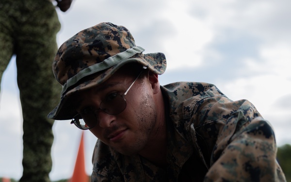 U.S. Marines with Littoral Craft Company Charlie participate in an exercise gauntlet during the Colombian Fluvial Operations Course