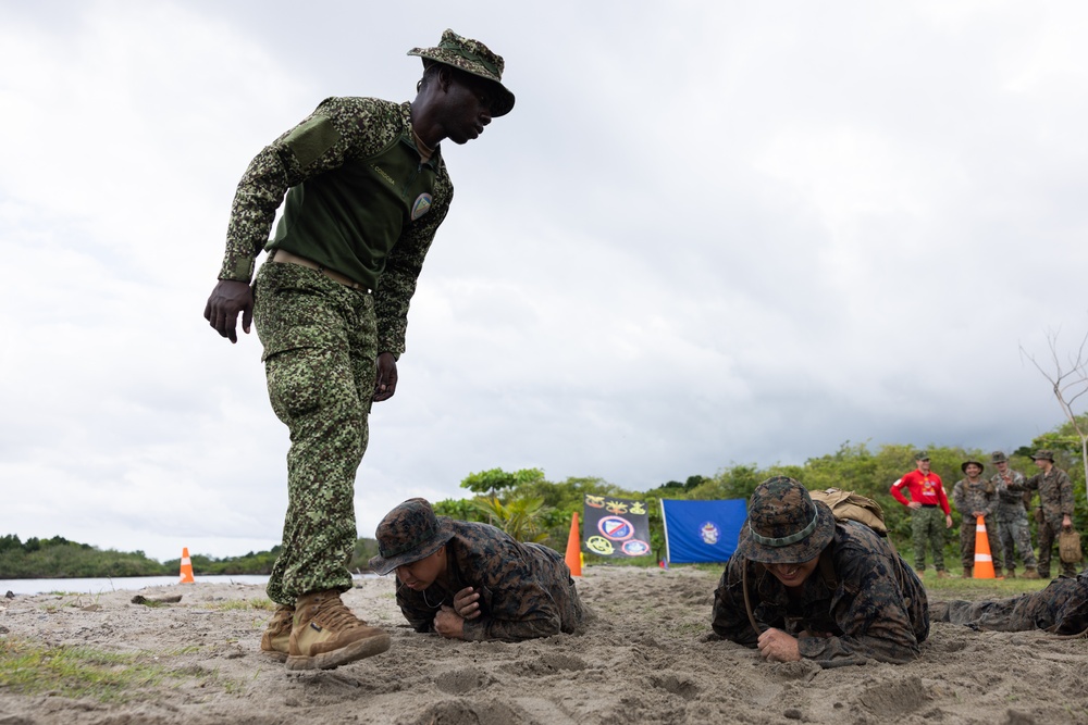 U.S. Marines with Littoral Craft Company Charlie participate in an exercise gauntlet during the Colombian Fluvial Operations Course