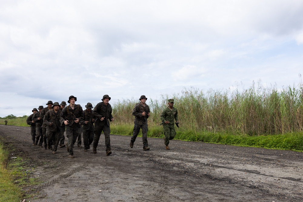 U.S. Marines with Littoral Craft Company Charlie participate in an exercise gauntlet during the Colombian Fluvial Operations Course