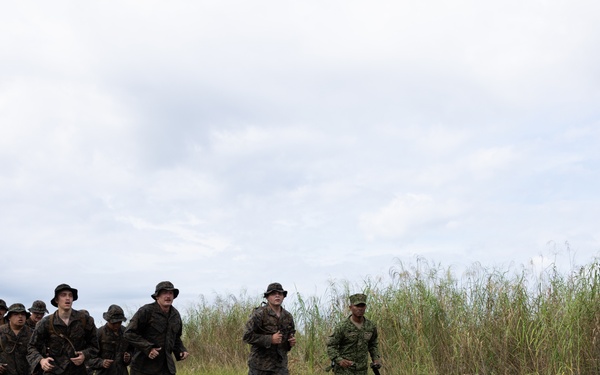 U.S. Marines with Littoral Craft Company Charlie participate in an exercise gauntlet during the Colombian Fluvial Operations Course