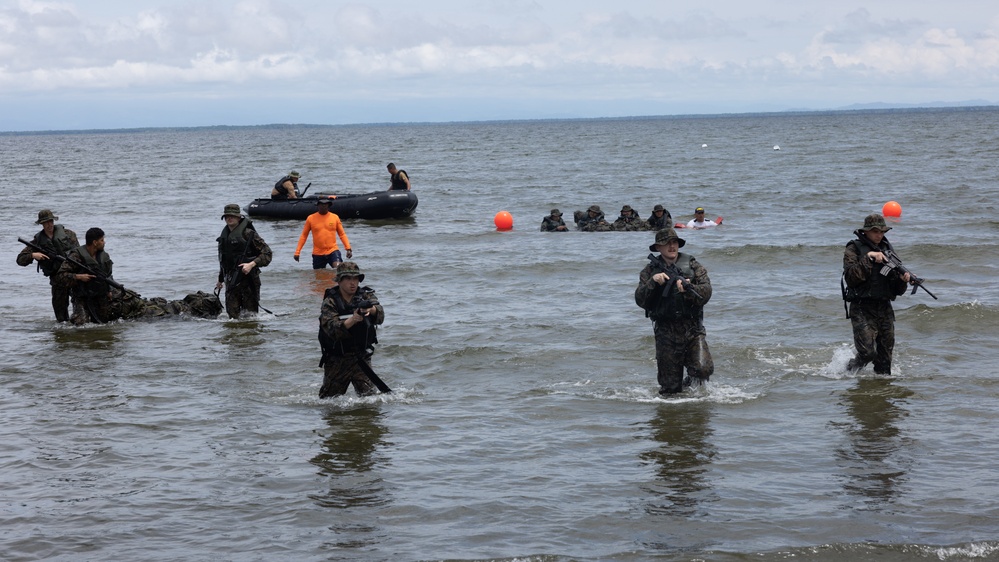 U.S. Marines with Littoral Craft Company Charlie participate in an exercise gauntlet during the Colombian Fluvial Operations Course