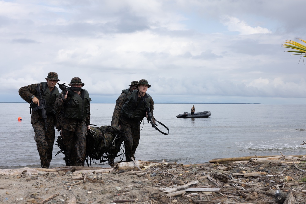 U.S. Marines with Littoral Craft Company Charlie participate in an exercise gauntlet during the Colombian Fluvial Operations Course