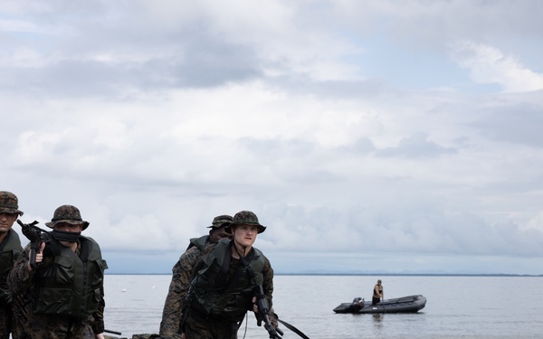 U.S. Marines with Littoral Craft Company Charlie participate in an exercise gauntlet during the Colombian Fluvial Operations Course