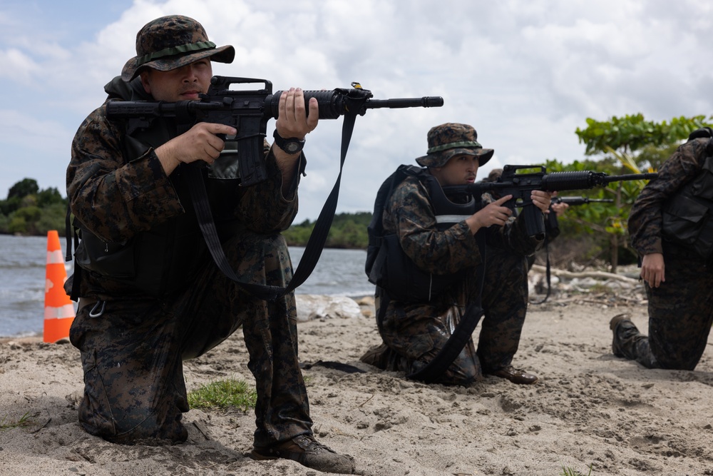 U.S. Marines with Littoral Craft Company Charlie participate in an exercise gauntlet during the Colombian Fluvial Operations Course