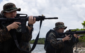 U.S. Marines with Littoral Craft Company Charlie participate in an exercise gauntlet during the Colombian Fluvial Operations Course