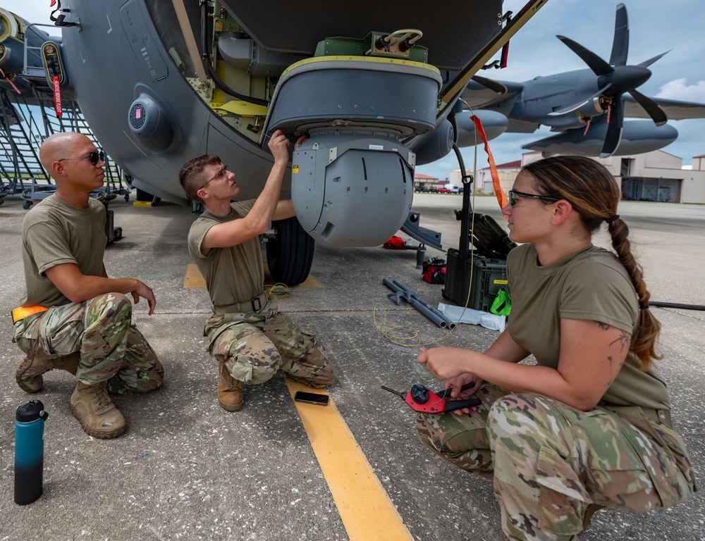 Installation of safety cables on the turret of the HC-130J Combat King II aircraft