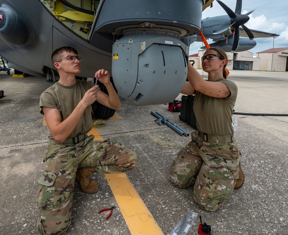 Installation of safety cables on the turret of the HC-130J Combat King II aircraft