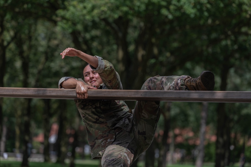 1st Lt. Brianna Mirmina negotiates an obstacle