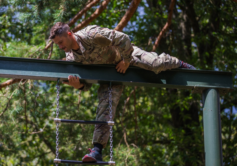 Staff Sergeant James A. Lavoie navigates over an obstacle