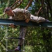 Staff Sergeant James A. Lavoie navigates over an obstacle