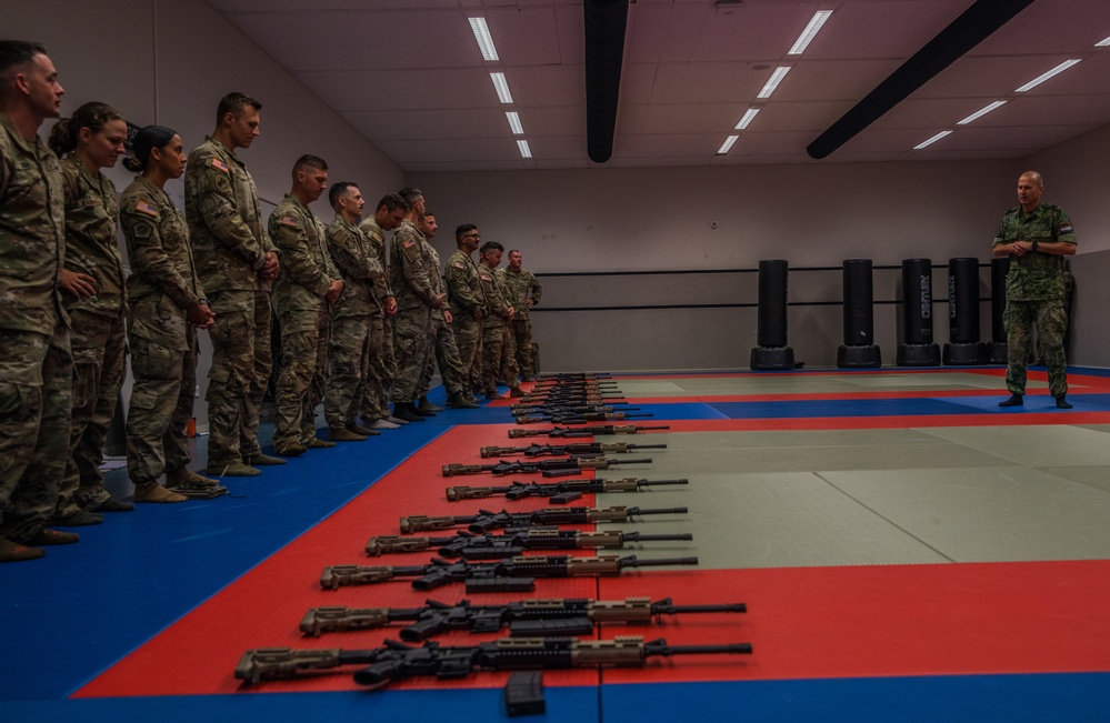 Service members conduct a rifle familiarization event