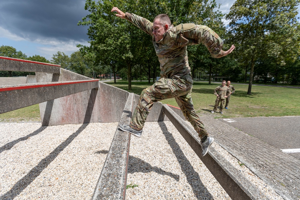 Capt. Zachary Grimes jumps up to the next step