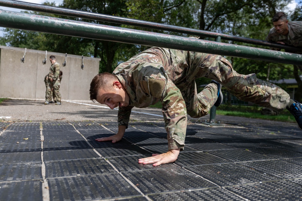 Staff Sgt. Conner Williams ducks under an obstacle