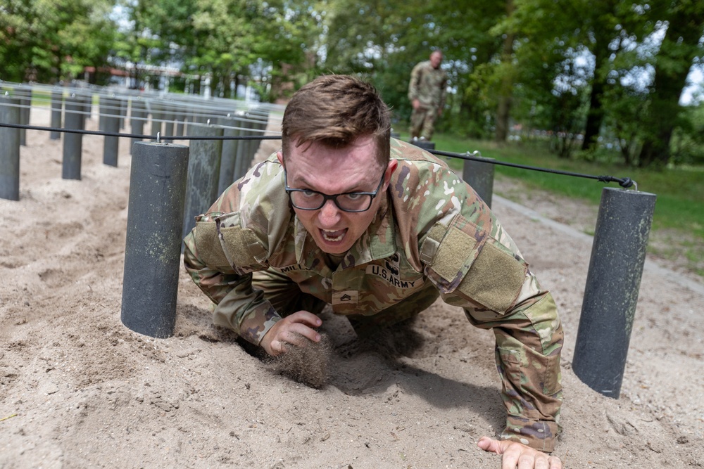 Staff Sgt. Zachary Mills rises