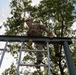 Staff Sgt. James Lavoie climbs over an obstacle