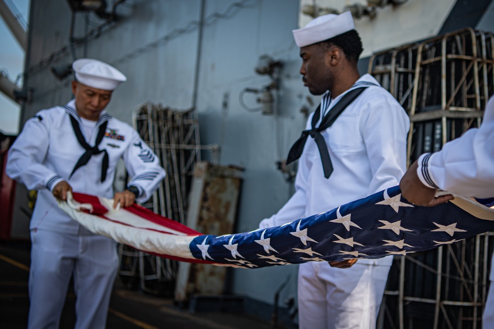 Nimitz Sailors Fold Flag