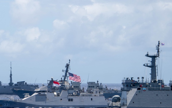 Multinational ships sail in formation during RIMPAC 2024
