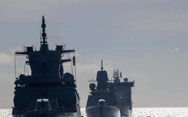Multinational ships sail in formation during RIMPAC 2024