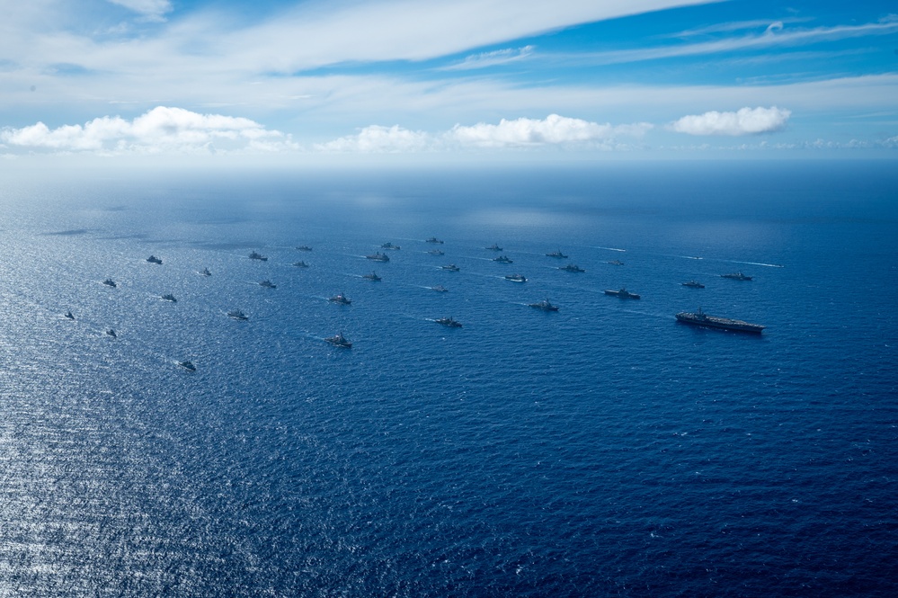 Multinational ships sail in formation during RIMPAC 2024