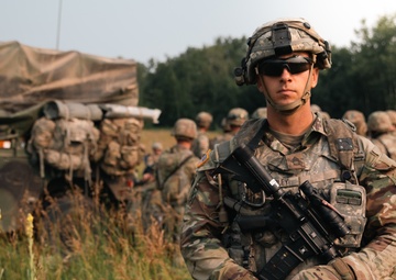 Iowa Army National Guard field artillery platoon sergeant poses for portrait
