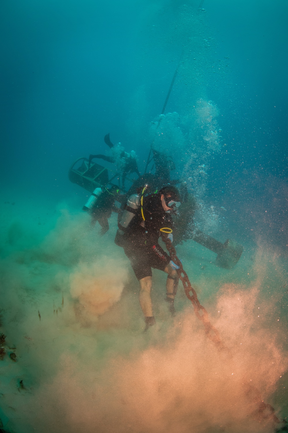 U.S. Coast Guard and Republic of Korea Navy Underwater Construction Team divers recover a sunken buoy during RIMPAC 2024