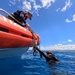 U.S. Coast Guard and Republic of Korea Navy Underwater Construction Team divers recover a sunken buoy during RIMPAC 2024