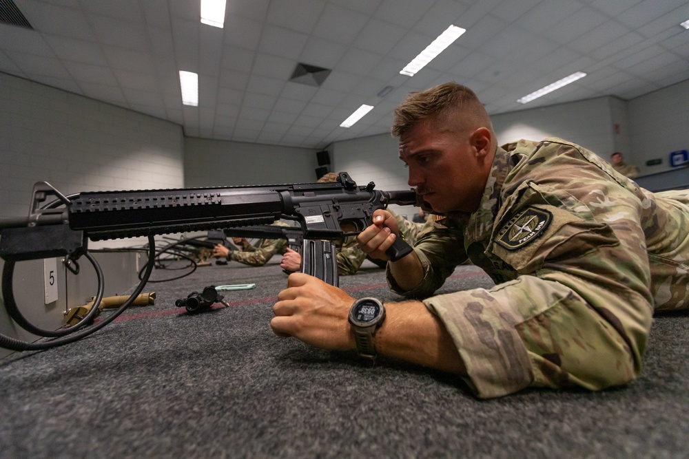 Capt. Jack Straub loads a Colt C7NLD simulation rifle