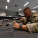 Capt. Jack Straub loads a Colt C7NLD simulation rifle