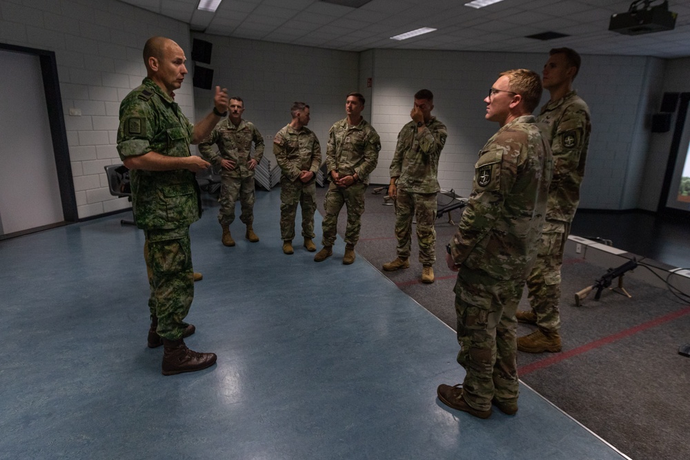 Sgt. Maj. Rik De Jager speaks with memebers of the U.S. CIOR team