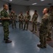 Sgt. Maj. Rik De Jager speaks with memebers of the U.S. CIOR team