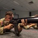 Sgt. Trenton Tuberosa fires a Colt C7NLD simulation rifle