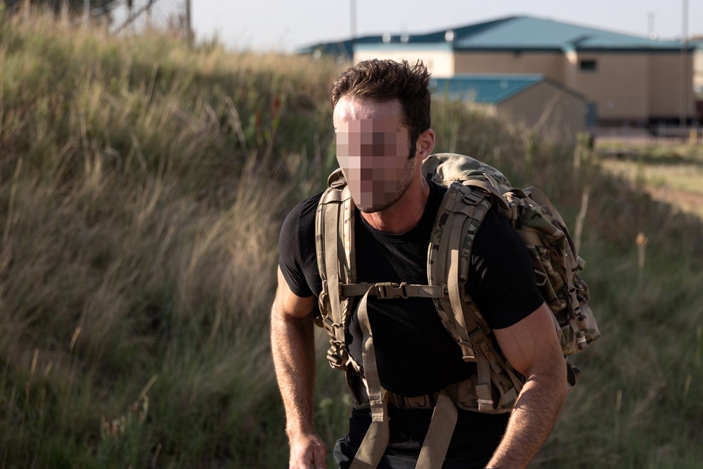 10th SFG(A) Soldier rucks towards finish line