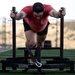 10th SFG(A) Soldier pushes sled for Fittest Original