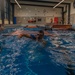 Lieutenant Colonel James M. Fink navigates a practice swim obstacle course